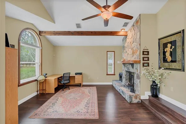 a dining room with furniture and window