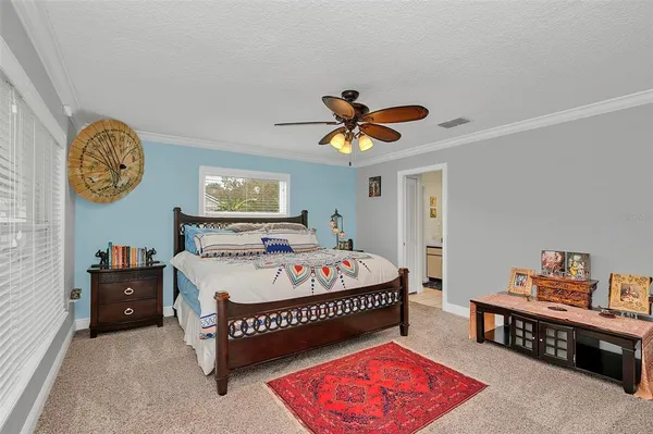 a dining hall with stainless steel appliances a dining table and chairs with wooden floor