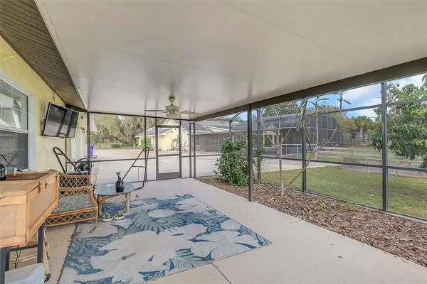 a view of a swimming pool with a patio