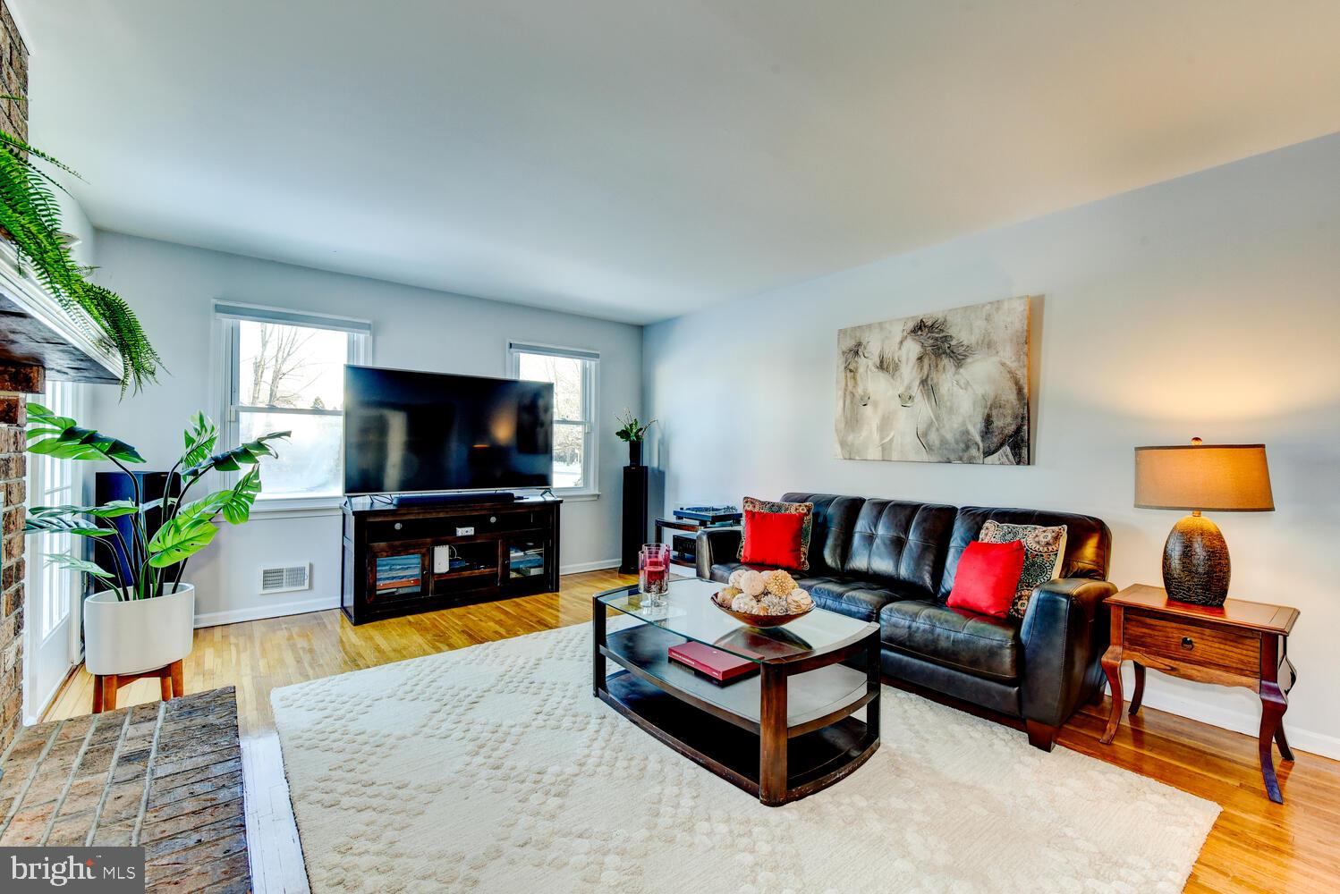374 Village Road East Princeton Junction, NJ 08550 - Photo 28 of 54 a living room with furniture and a flat screen tv