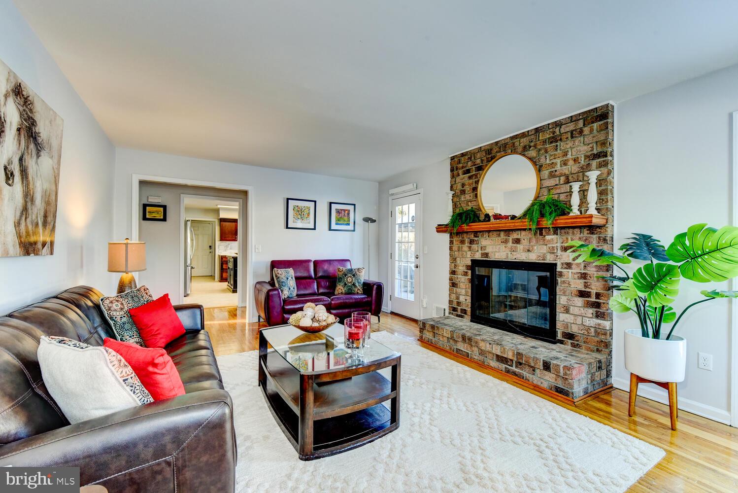 374 Village Road East Princeton Junction, NJ 08550 - Photo 30 of 54 a living room with furniture and a fireplace