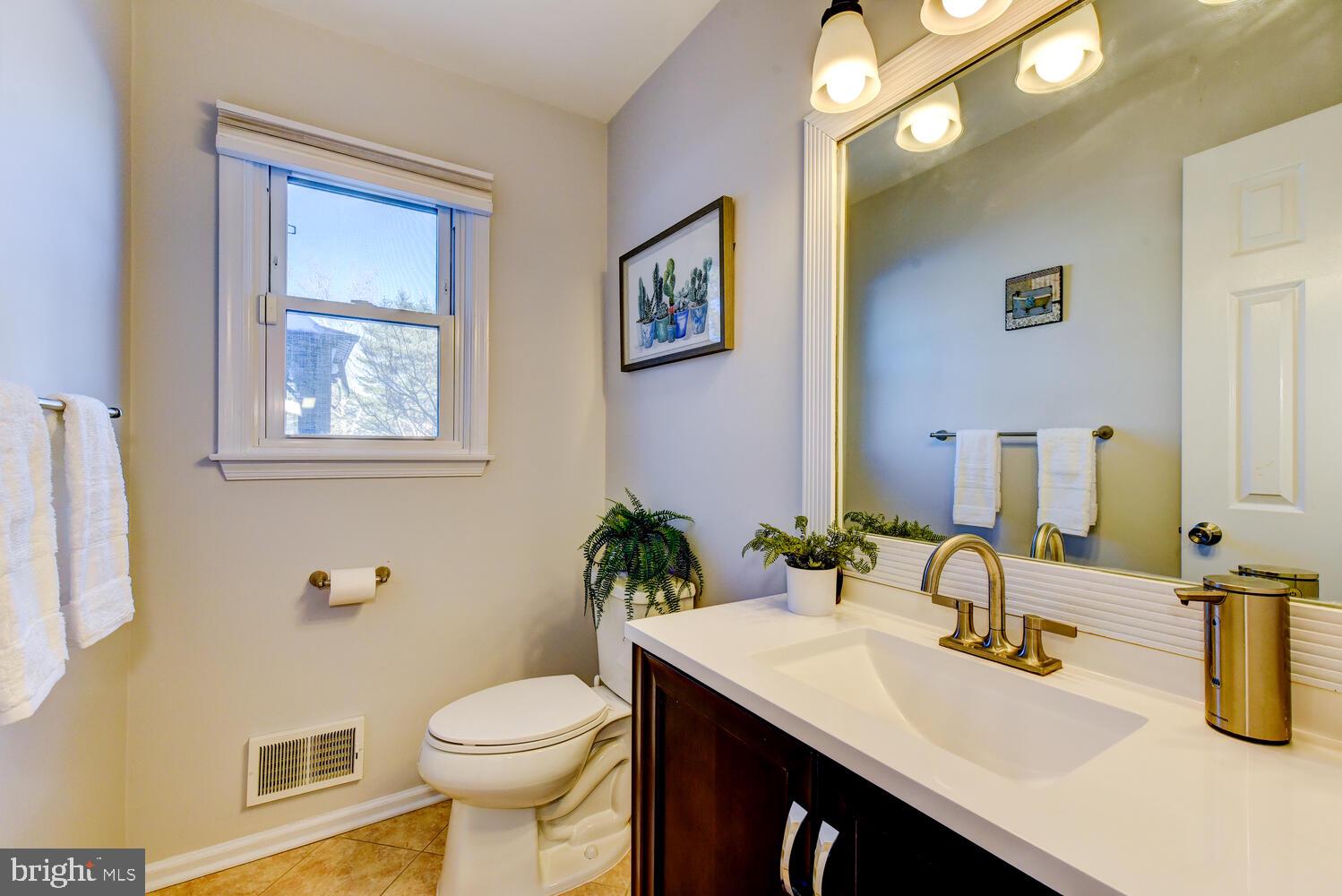 374 Village Road East Princeton Junction, NJ 08550 - Photo 32 of 54 a bathroom with a sink a toilet and mirror