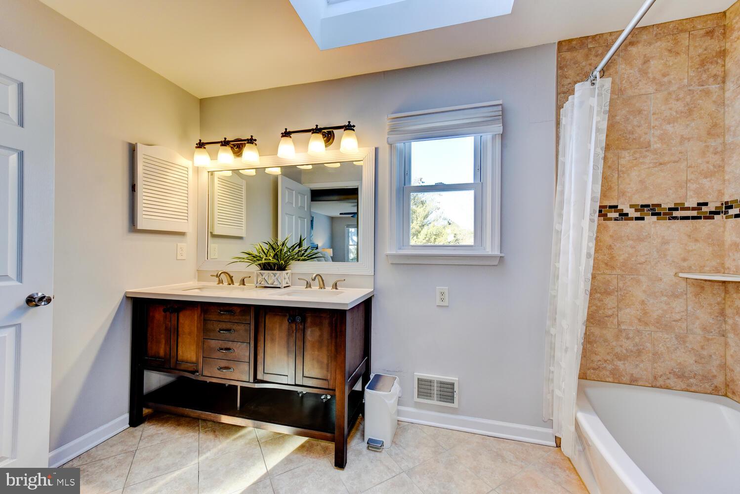 374 Village Road East Princeton Junction, NJ 08550 - Photo 38 of 54 a bathroom with a sink and a mirror