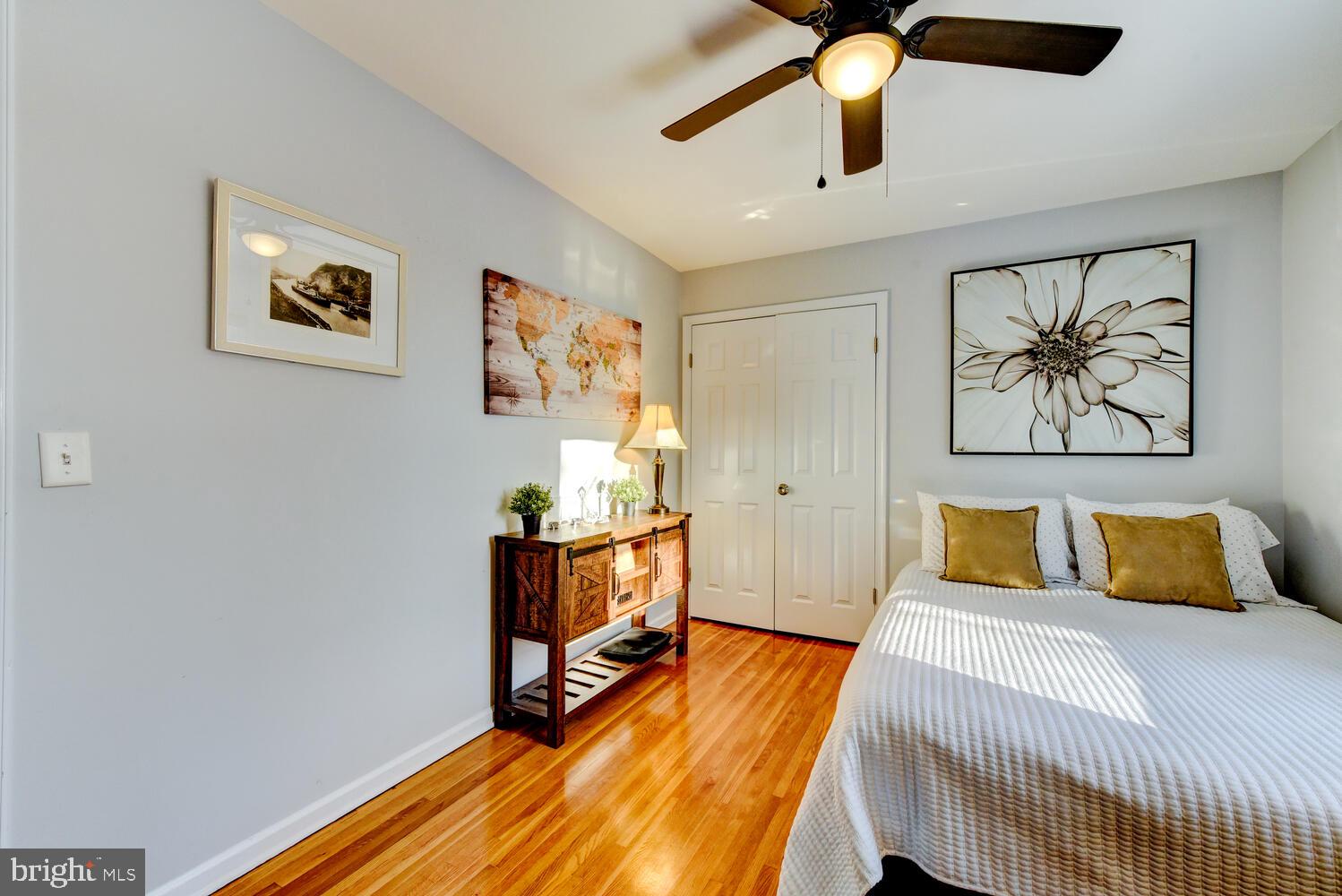 374 Village Road East Princeton Junction, NJ 08550 - Photo 40 of 54 a bedroom with a bed and a chandelier