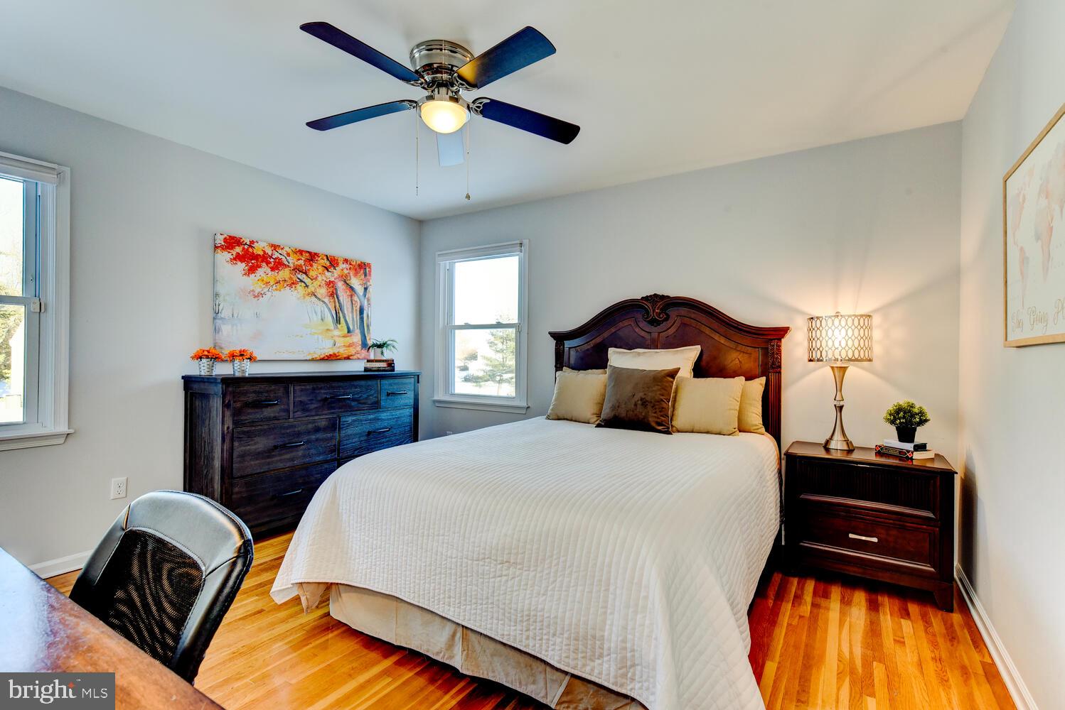 374 Village Road East Princeton Junction, NJ 08550 - Photo 41 of 54 a bedroom with a bed and a chandelier