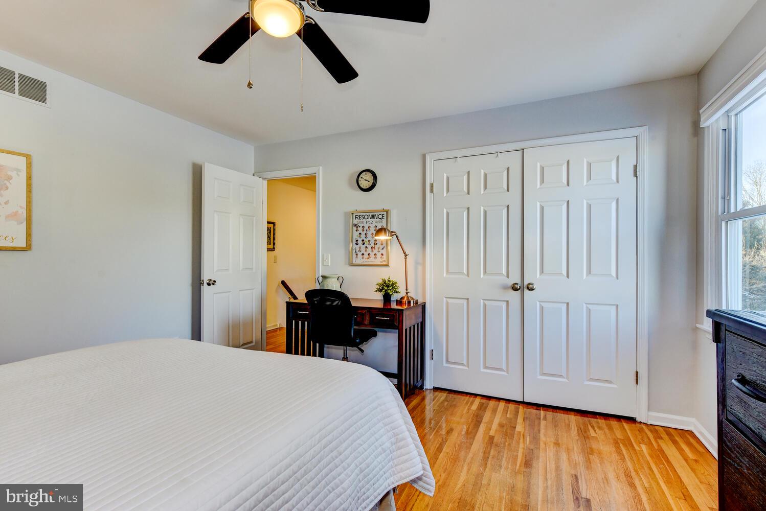 374 Village Road East Princeton Junction, NJ 08550 - Photo 42 of 54 a bedroom with a bed and wooden floor