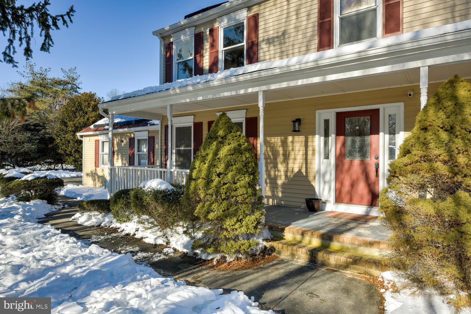 374 Village Road East Princeton Junction, NJ 08550 - Photo 6 of 54 a view of a house with a small yard and potted plants