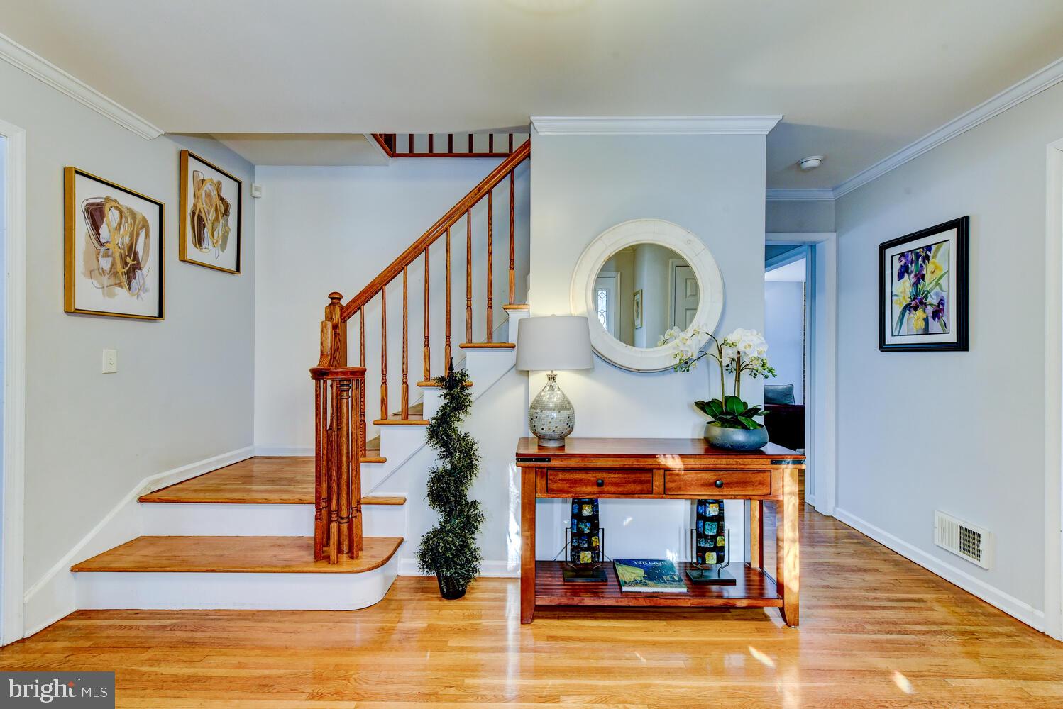 374 Village Road East Princeton Junction, NJ 08550 - Photo 9 of 54 a view of entryway and hall with wooden floor