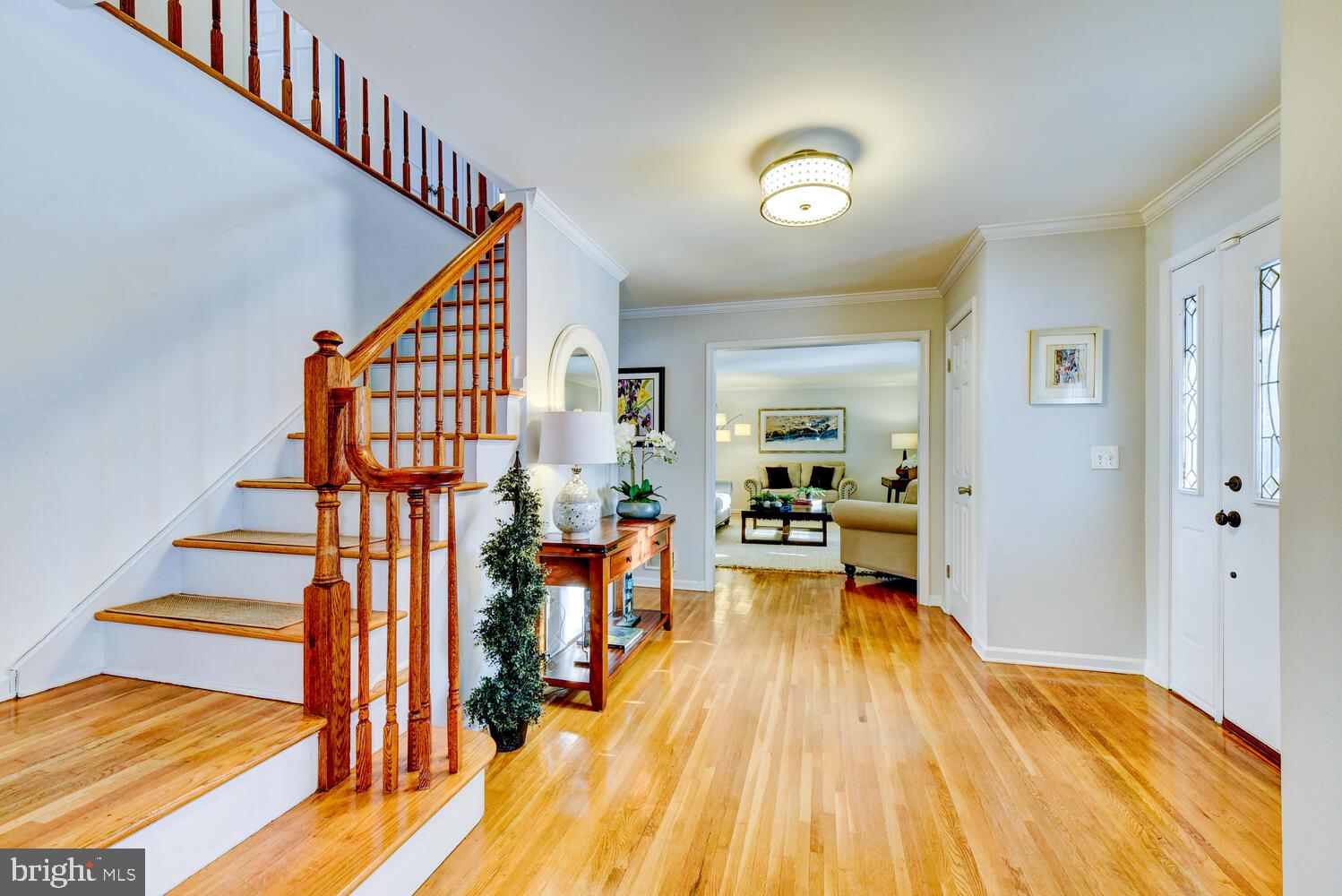 374 Village Road East Princeton Junction, NJ 08550 - Photo 10 of 54 a view of entryway and hall with wooden floor
