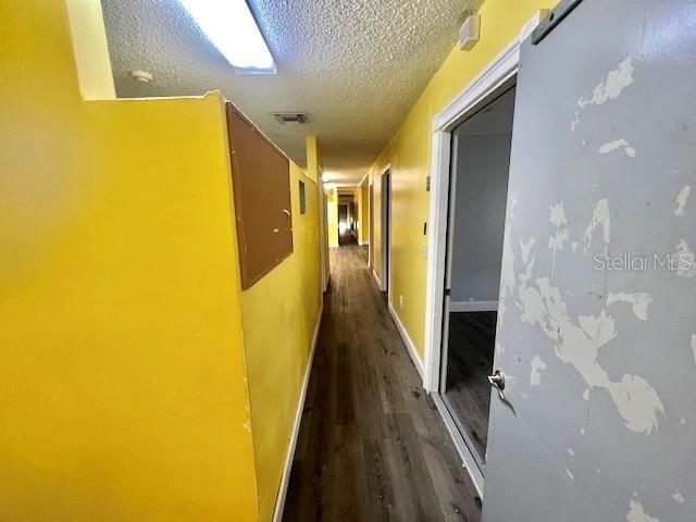4527 Carter Street Orlando, FL 32811 - Photo 13 of 13 a view of a hallway with wooden floor