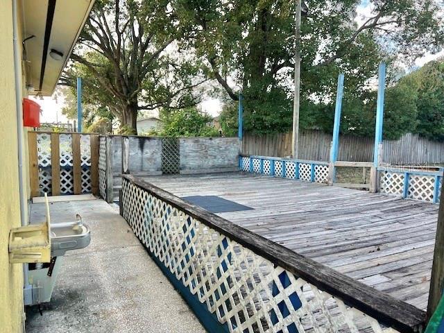 4527 Carter Street Orlando, FL 32811 - Photo 5 of 13 a view of balcony with wooden floor and outdoor seating