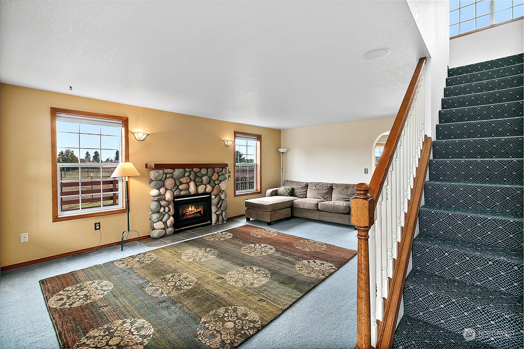 17036 Kaylen Lane Southwest Rochester, WA 98579 - Photo 3 of 40 a living room with furniture and a fireplace