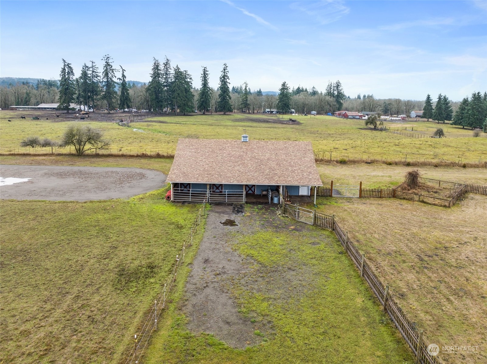 17036 Kaylen Lane Southwest Rochester, WA 98579 - Photo 35 of 40 a view of a swimming pool and trees in the background