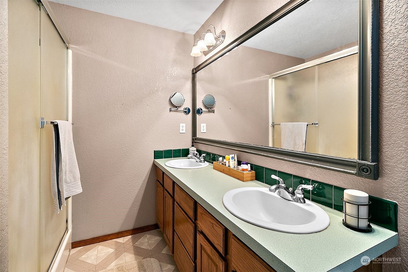 17036 Kaylen Lane Southwest Rochester, WA 98579 - Photo 7 of 40 a bathroom with a sink double vanity and a mirror