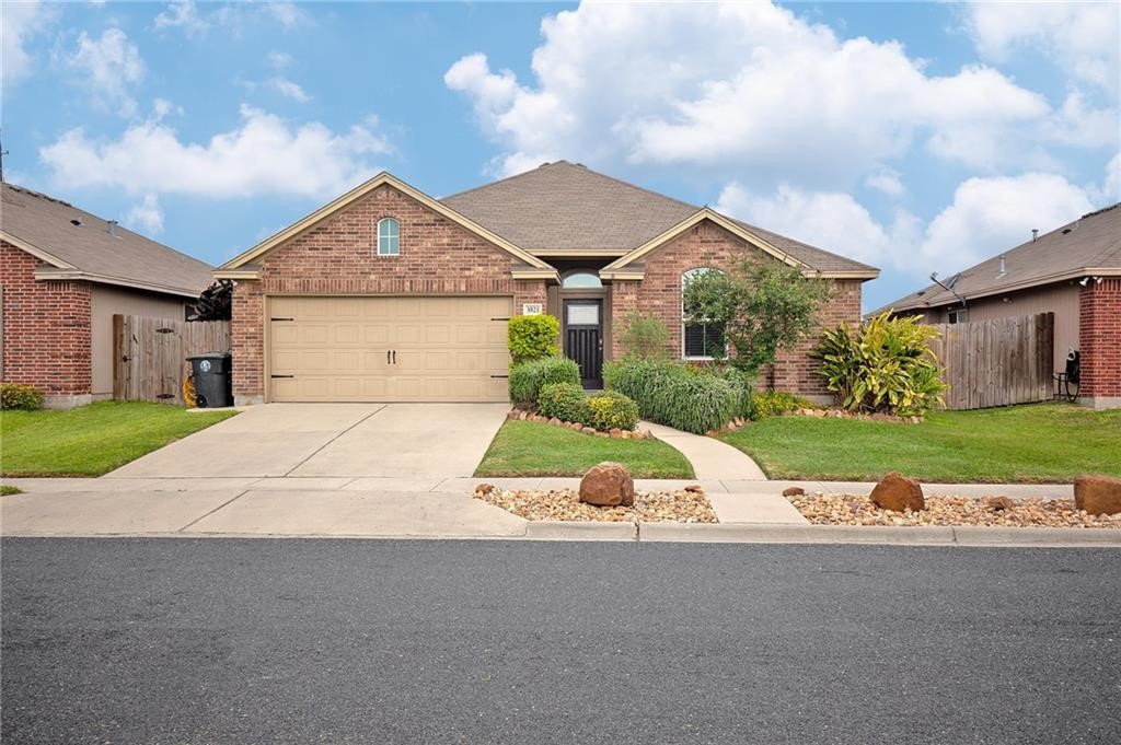 a view of house with yard