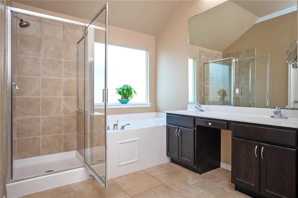 3921 Las Bahias Drive Corpus Christi, TX 78414 - Photo 12 of 16 a bathroom with a shower sink and mirror