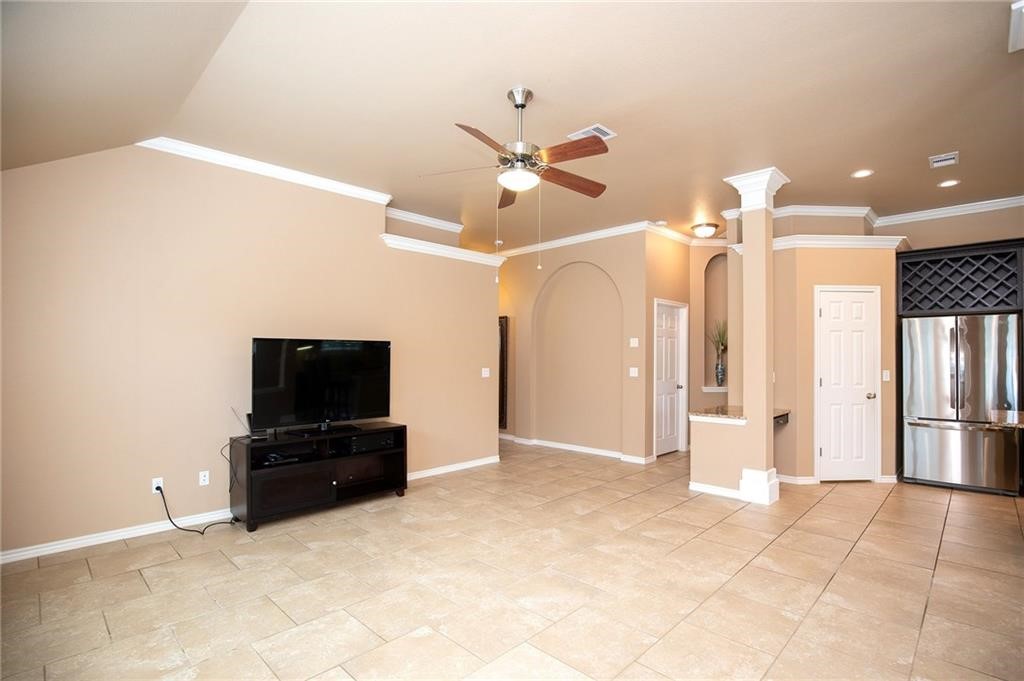3921 Las Bahias Drive Corpus Christi, TX 78414 - Photo 5 of 16 a view of a livingroom with a flat screen tv and ceiling fan