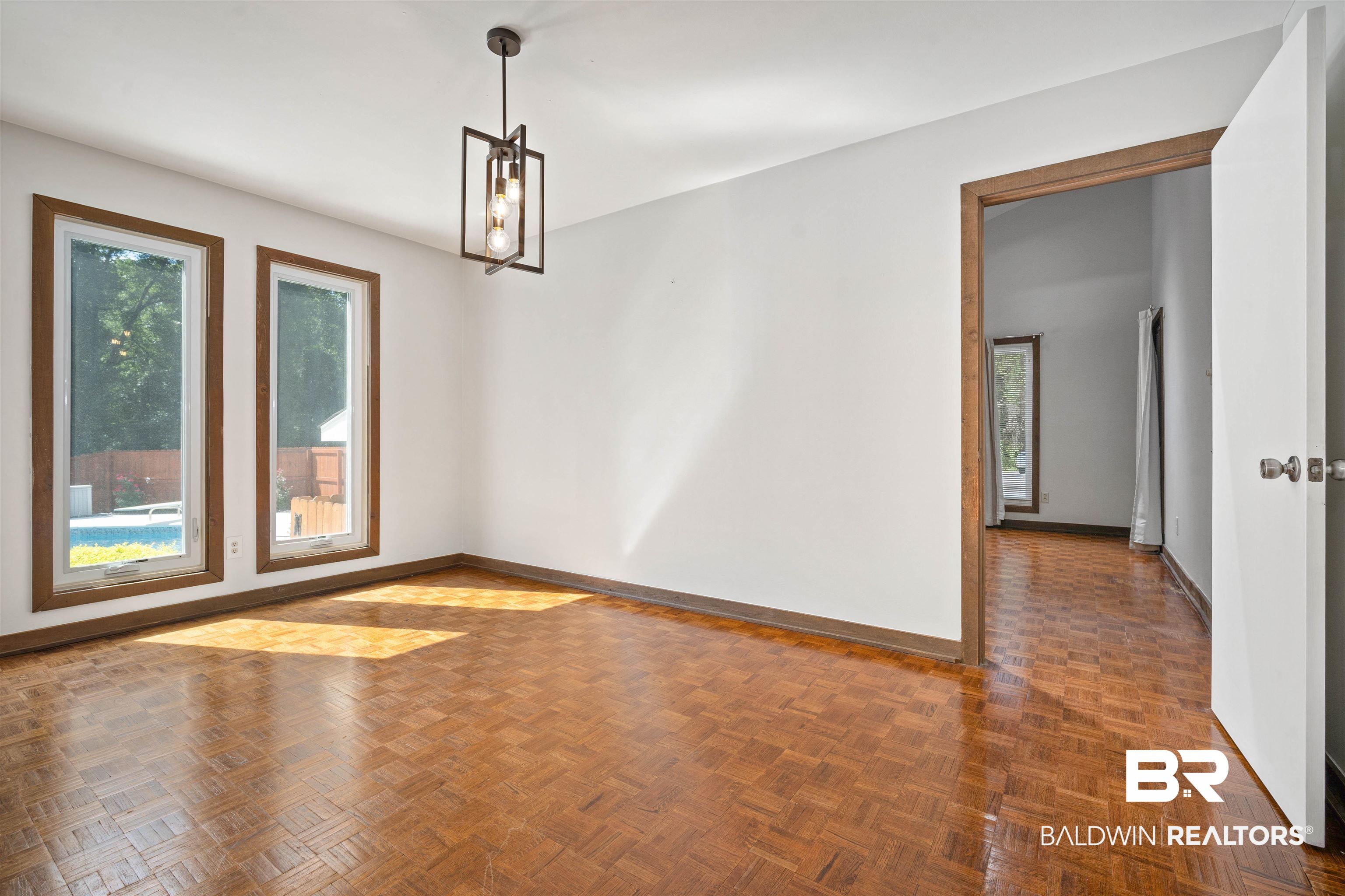 7912 Yorkhaven Road Mobile, AL 36695 - Photo 13 of 41 Spare room featuring baseboards and a chandelier
