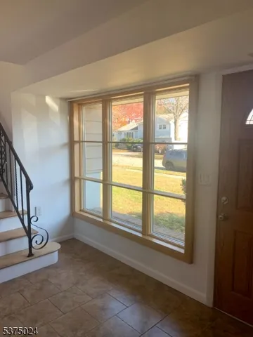 a view of an empty room and a window
