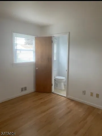 a view of a room that has a window in it