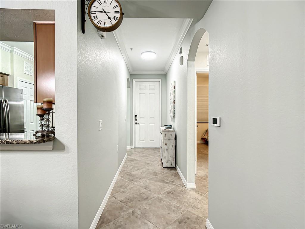 9554 Trevi Court, Unit 4715 Naples, FL 34113 - Photo 17 of 49 a view of a hallway with elevator