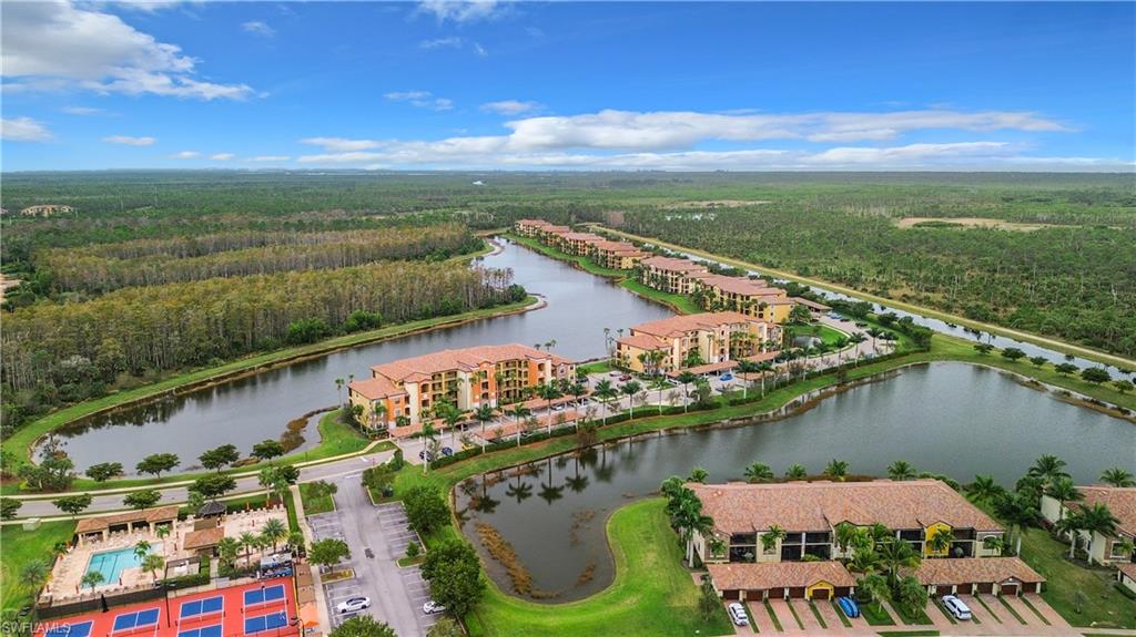 9554 Trevi Court, Unit 4715 Naples, FL 34113 - Photo 2 of 49 a view of a city and a lake view