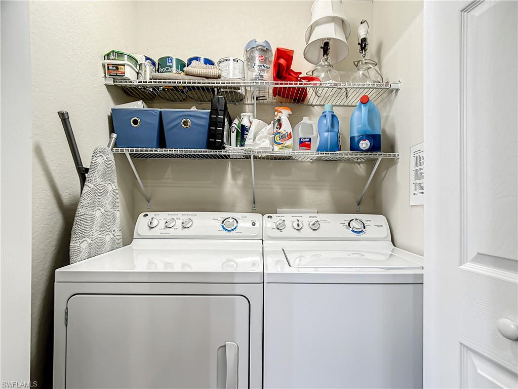 9554 Trevi Court, Unit 4715 Naples, FL 34113 - Photo 47 of 49 a utility room with dryer and washer