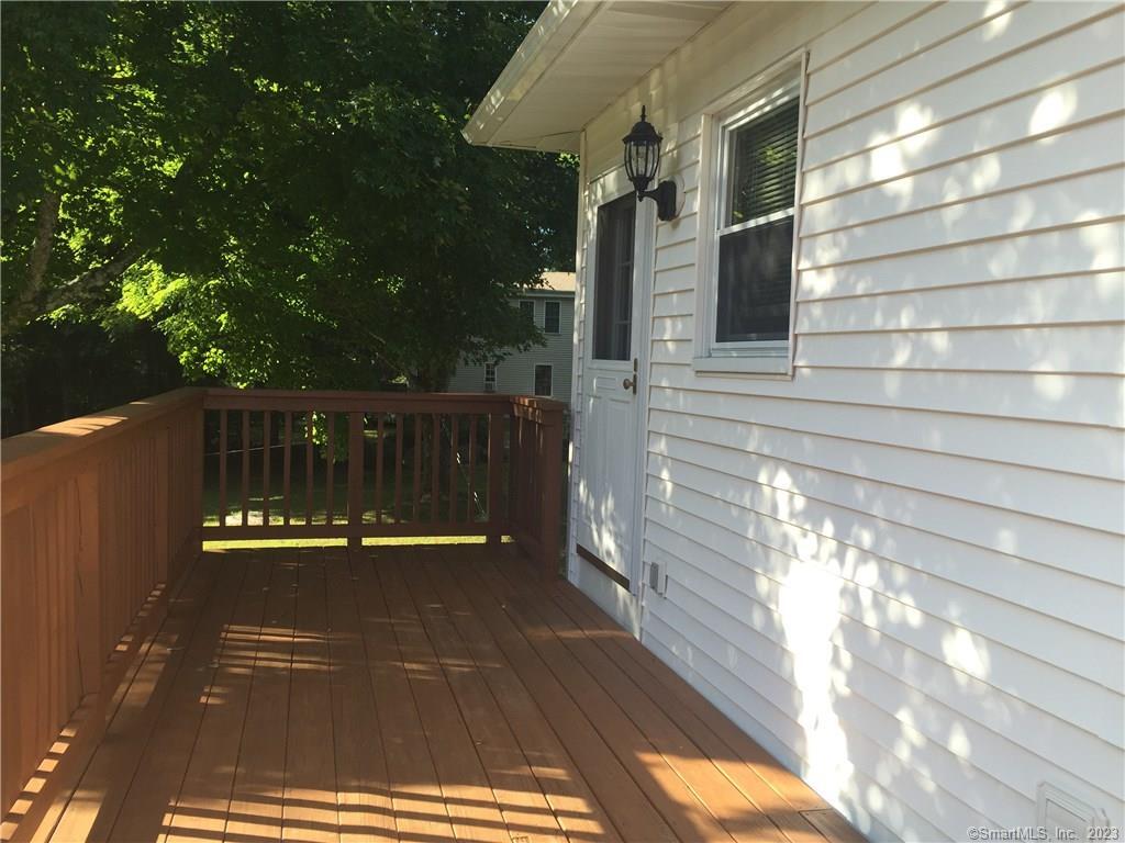 a view of balcony with furniture