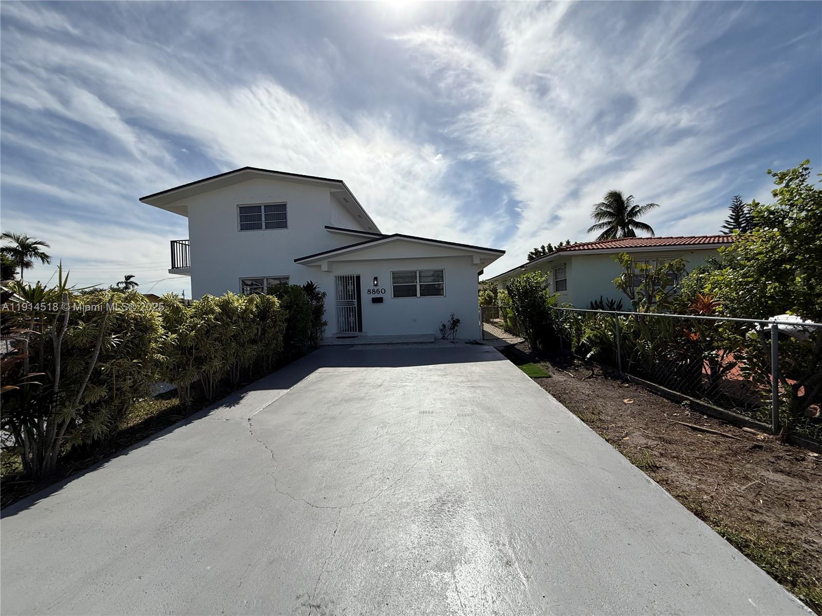a house view with a garden space