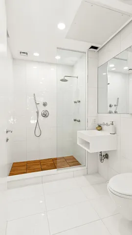 a bathroom with a sink a toilet and a bathtub