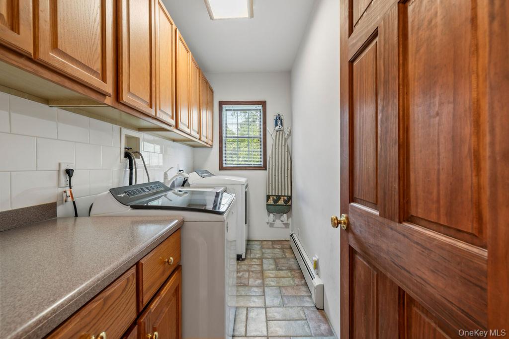 289 Seven Springs Mountain Road Monroe, NY 10950 - Photo 10 of 25 a kitchen with stainless steel appliances a sink and cabinets
