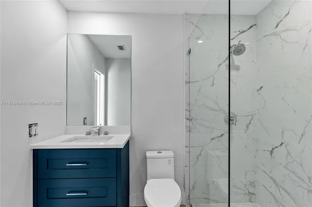 an aerial view of a house with a swimming pool and garden view