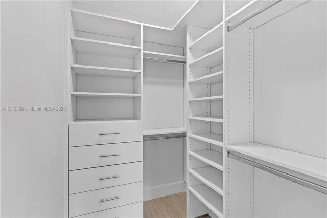 an aerial view of residential houses with outdoor space and swimming pool