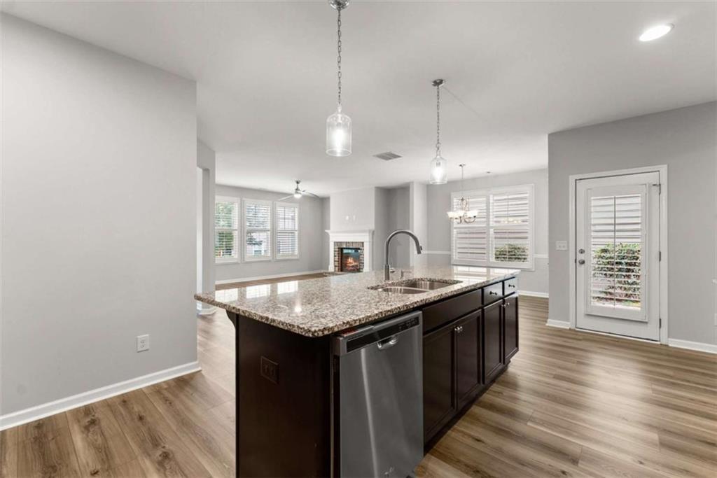 6021 Harbour Mist Drive Flowery Branch, GA 30542 - Photo 11 of 36 a kitchen with counter top space and sink