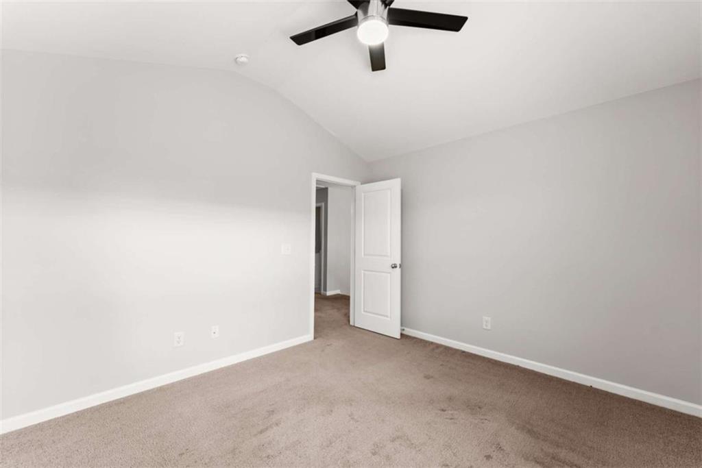 6021 Harbour Mist Drive Flowery Branch, GA 30542 - Photo 19 of 36 an empty room with a ceiling fan and window