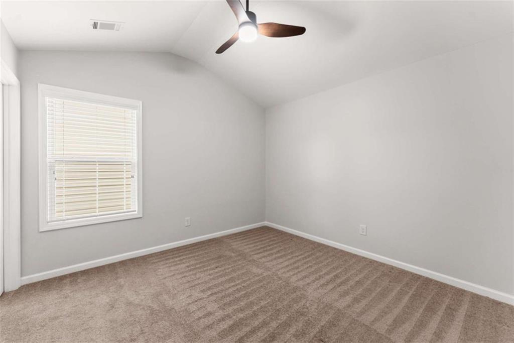 6021 Harbour Mist Drive Flowery Branch, GA 30542 - Photo 21 of 36 an empty room with a window