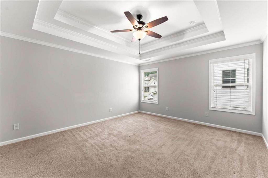 6021 Harbour Mist Drive Flowery Branch, GA 30542 - Photo 24 of 36 an empty room with windows and fan