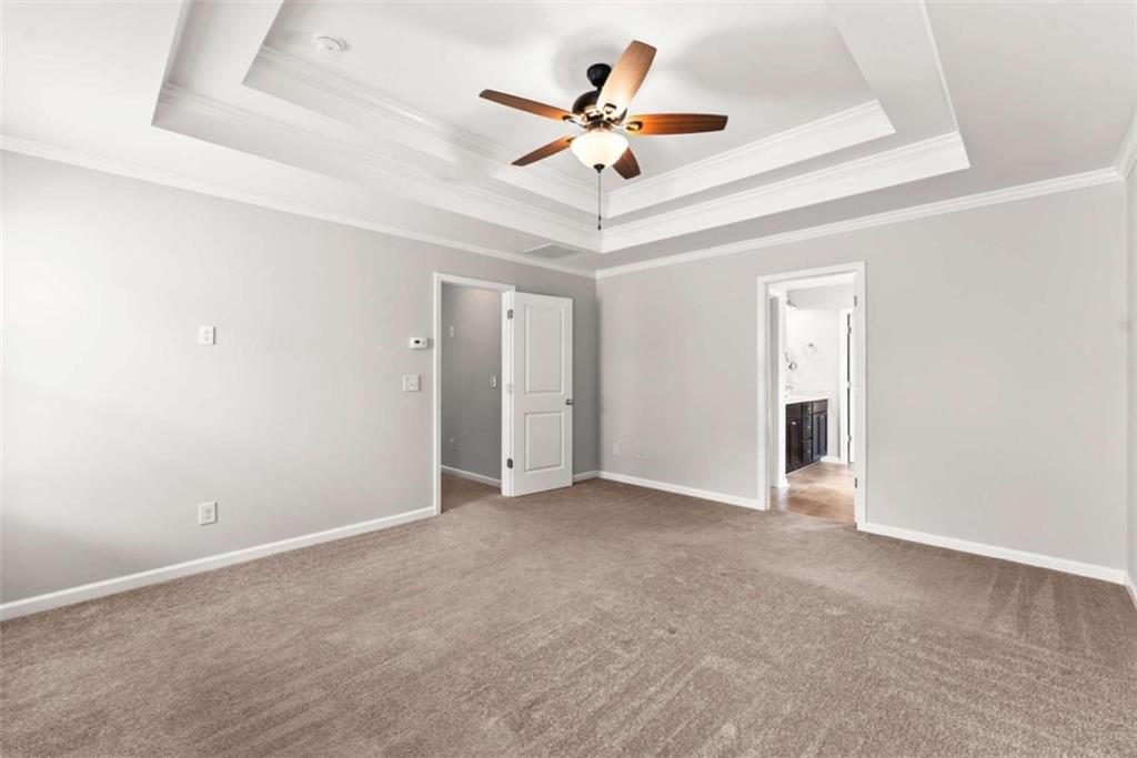 6021 Harbour Mist Drive Flowery Branch, GA 30542 - Photo 26 of 36 an empty room with ceiling fan and window