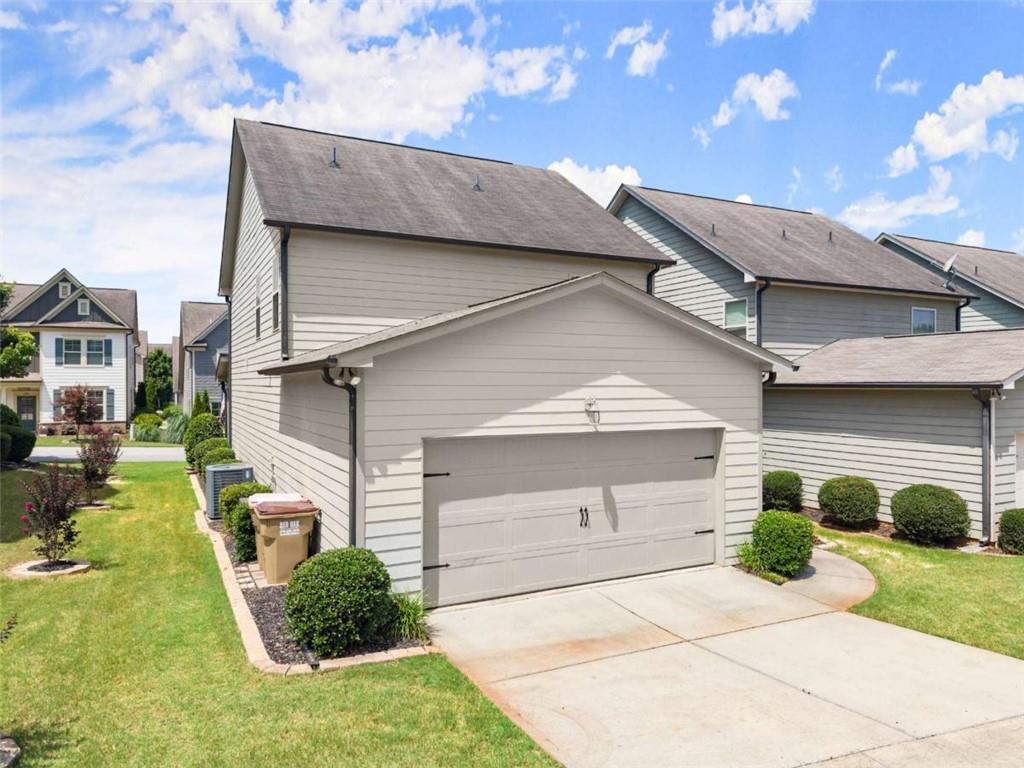 6021 Harbour Mist Drive Flowery Branch, GA 30542 - Photo 34 of 36 a view of a back yard of the house
