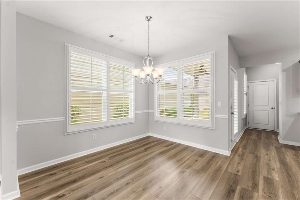 6021 Harbour Mist Drive Flowery Branch, GA 30542 - Photo 8 of 36 a view of an empty room with a window