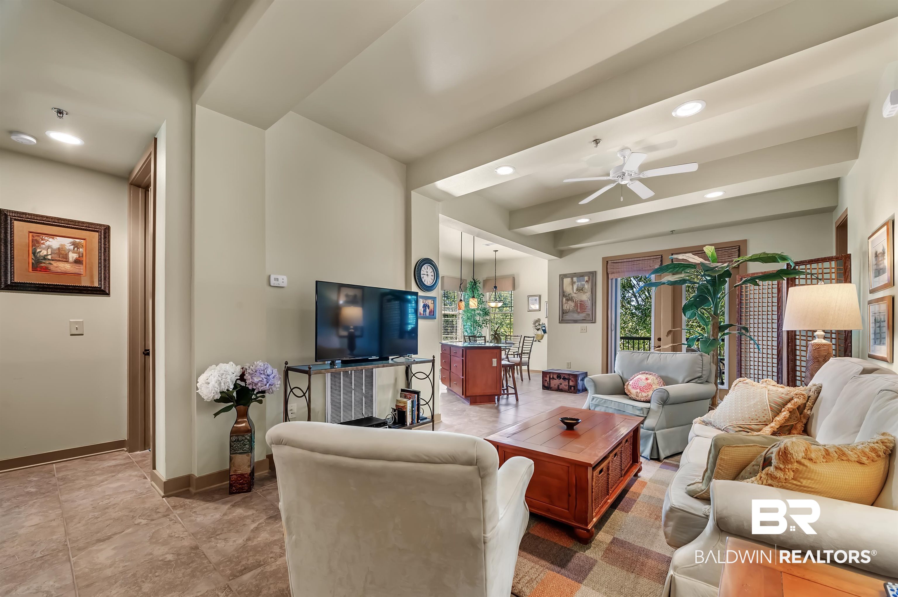 1430 Regency Road, Unit A301 Gulf Shores, AL 36542 - Photo 5 of 47 Living room with ceiling fan