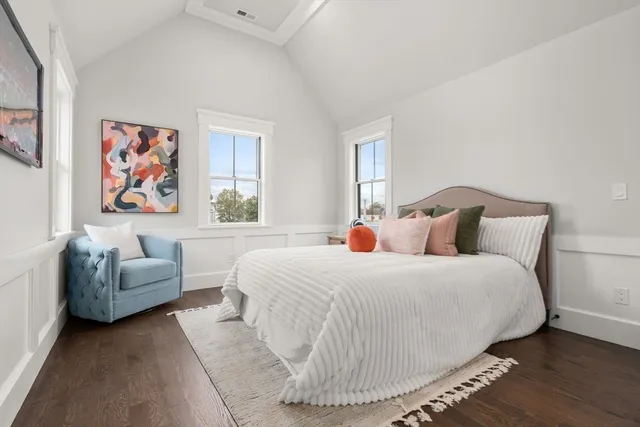 a bedroom with a bed and a couch