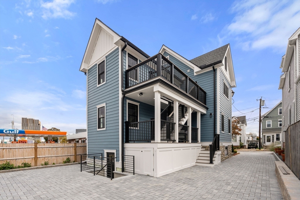11 Macarthur Street, Unit B Somerville, MA 02145 - Photo 24 of 28 a view of a white building among the street