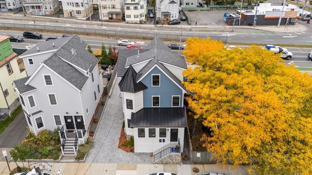 11 Macarthur Street, Unit B Somerville, MA 02145 - Photo 3 of 27 a front view of a house with swimming pool