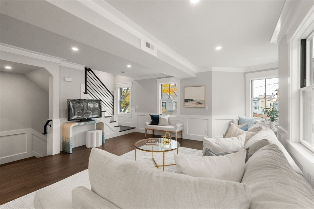 11 Macarthur Street, Unit B Somerville, MA 02145 - Photo 4 of 28 a living room with furniture and a wooden floor