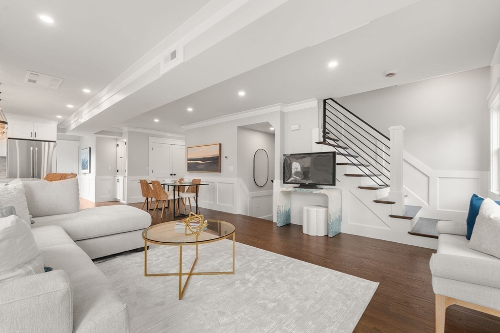 11 Macarthur Street, Unit B Somerville, MA 02145 - Photo 6 of 27 a living room with furniture and a flat screen tv
