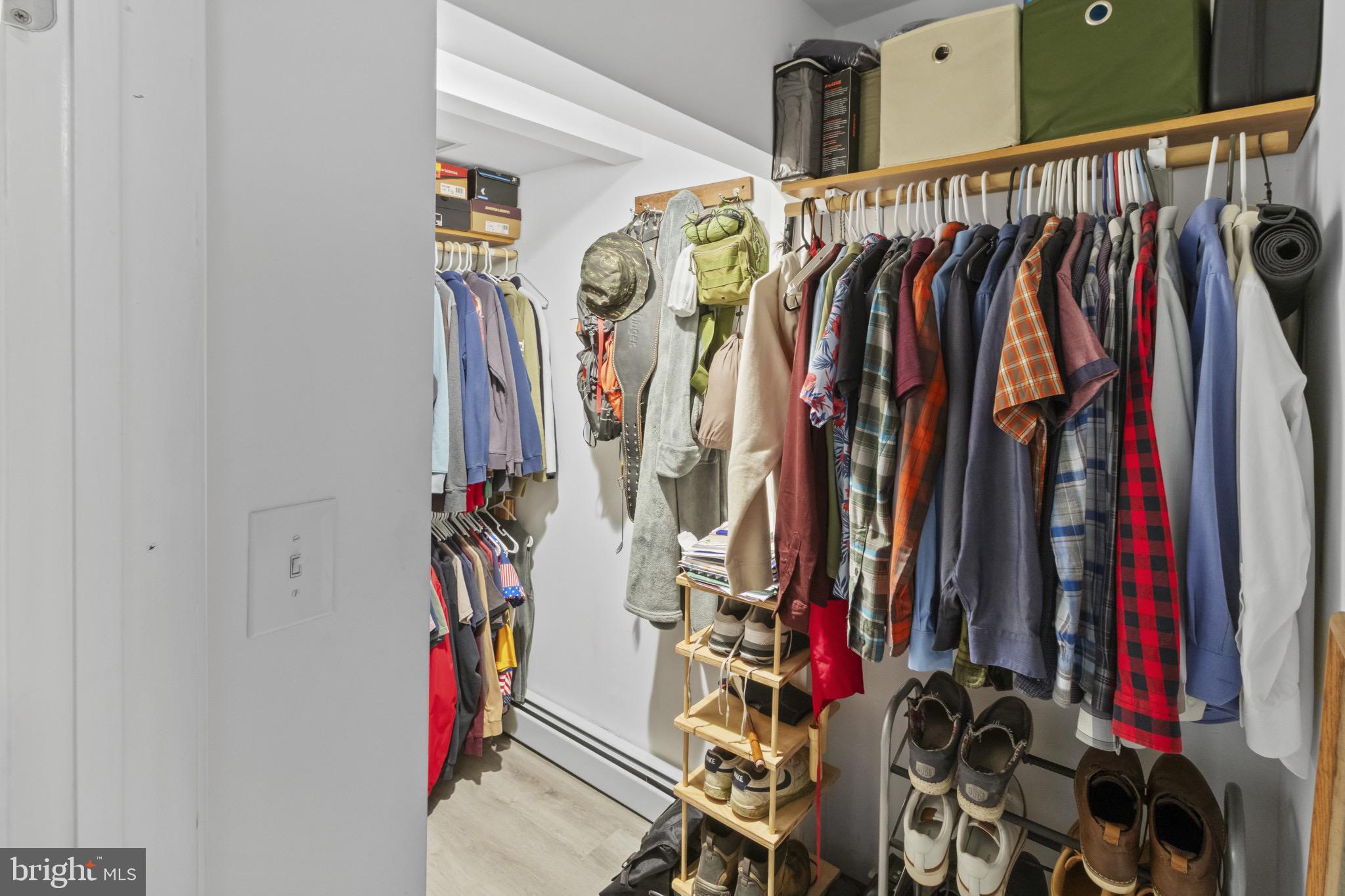 113 Risdon Street Mount Holly, NJ 08060 - Photo 17 of 25 Organized closet with stylish attire options.