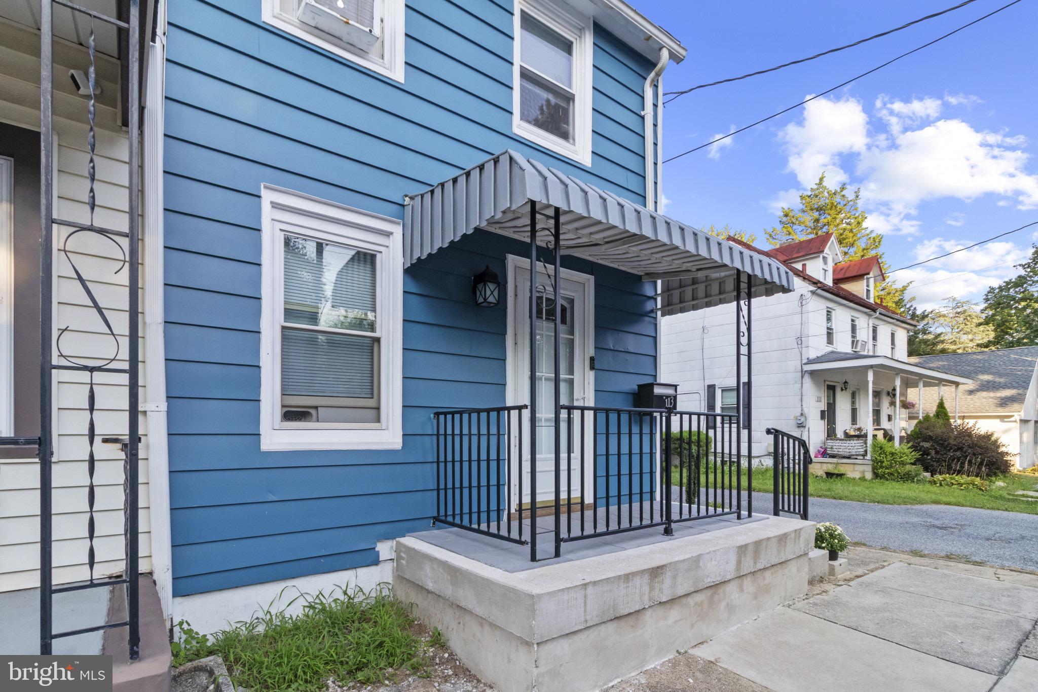 113 Risdon Street Mount Holly, NJ 08060 - Photo 2 of 25 Charming blue facade with welcoming entryway.