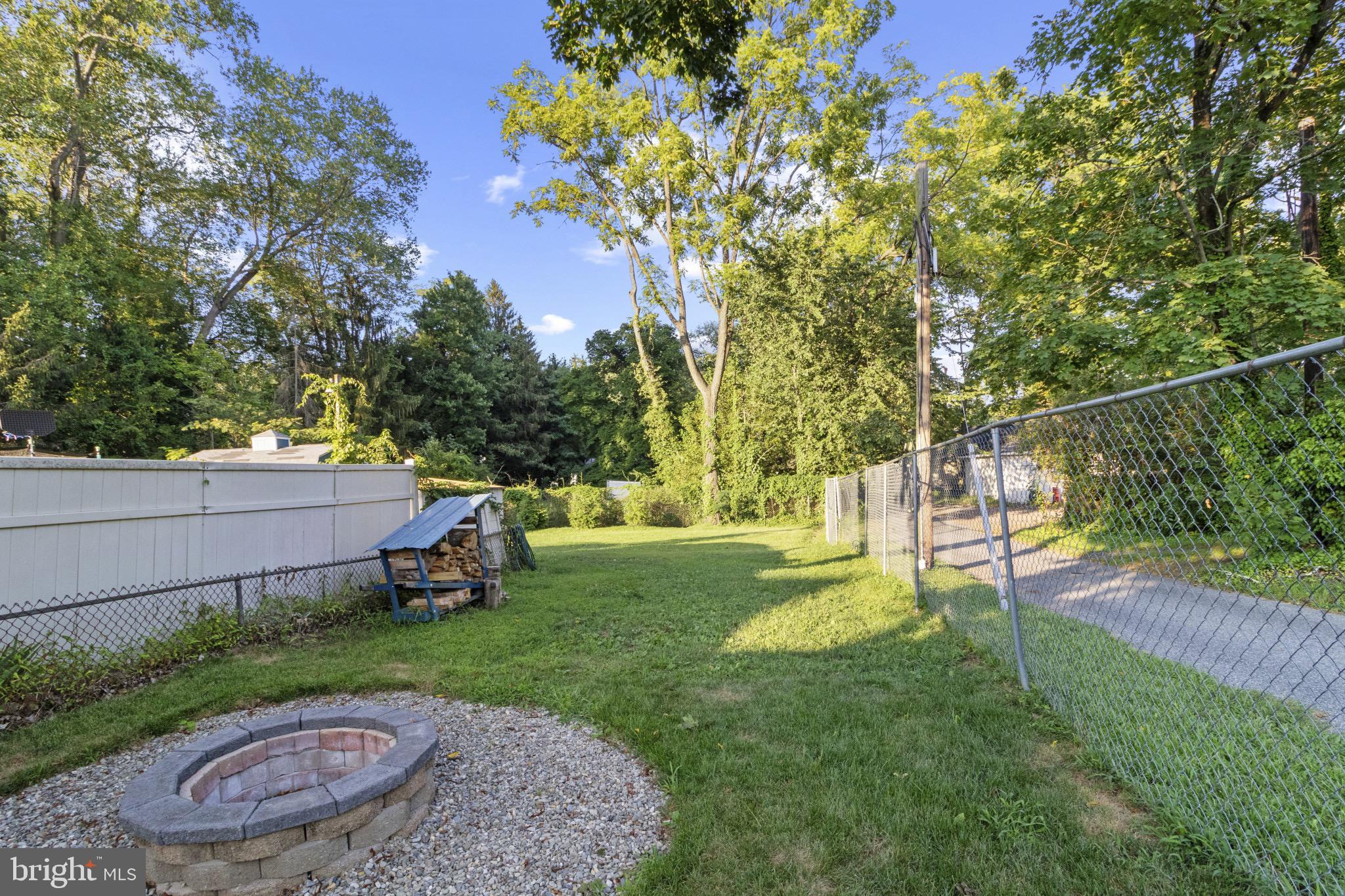 113 Risdon Street Mount Holly, NJ 08060 - Photo 22 of 25 Serene backyard oasis with fire pit charm.