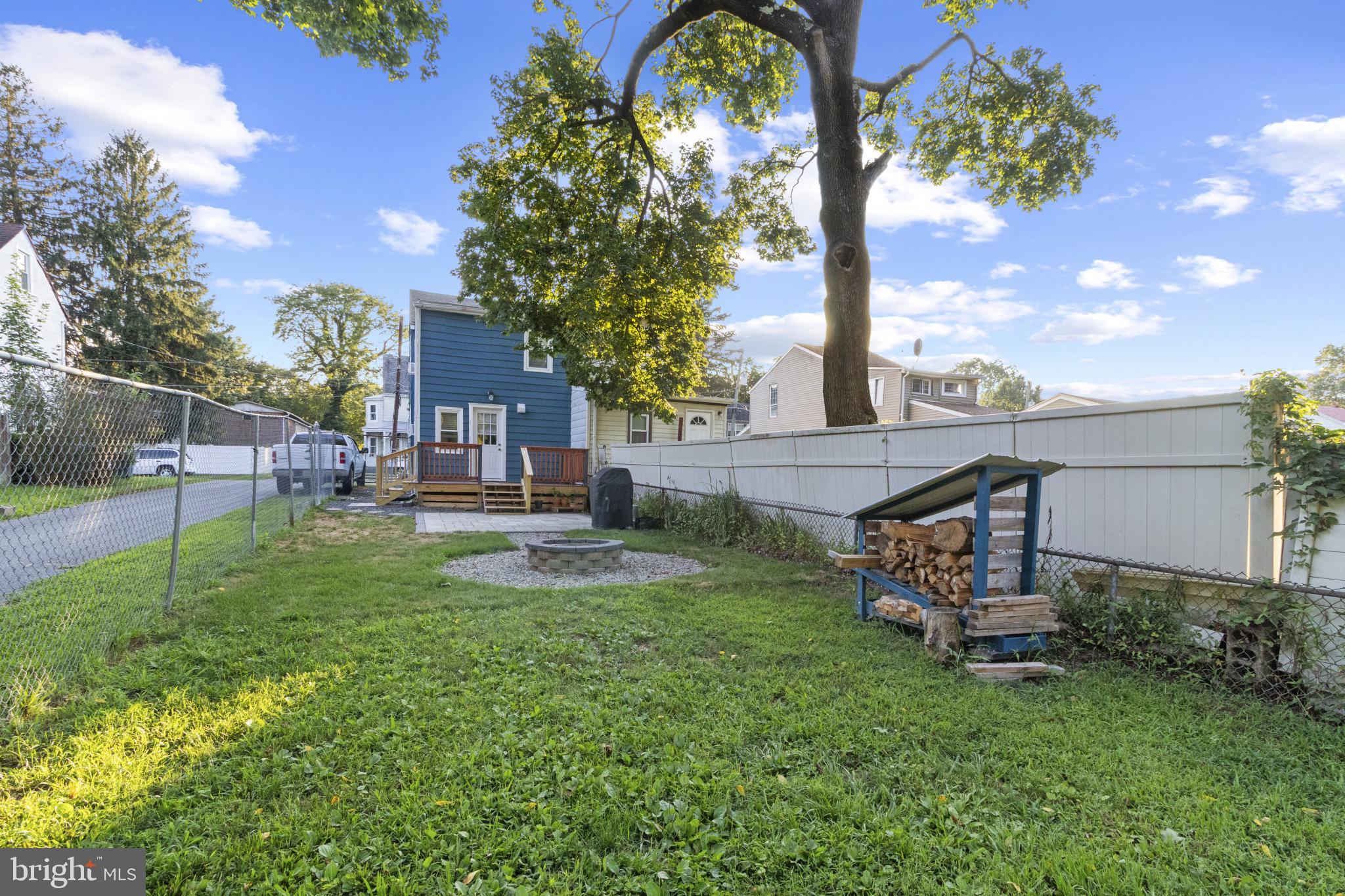 113 Risdon Street Mount Holly, NJ 08060 - Photo 23 of 25 Charming backyard oasis with lush greenery.